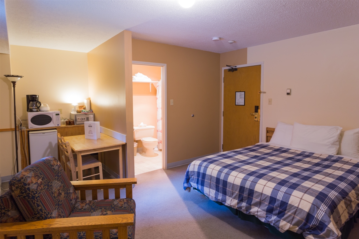 Compact Hotel Room at Griz Inn
