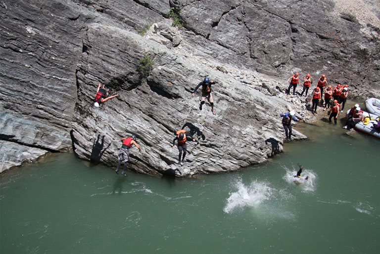 Cliff jumping in the canyon 
